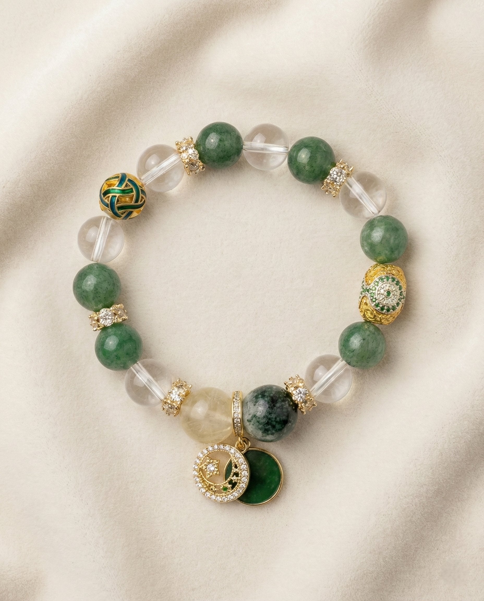 The Abundance Flow Bracelet, photographed from above on a light velvet background.