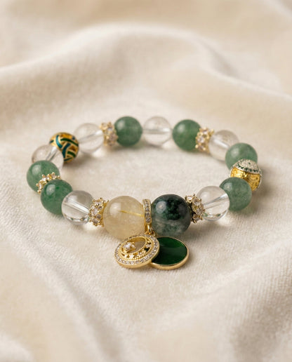 The Abundance Flow Bracelet, shown at a gentle angle on a light velvet surface.