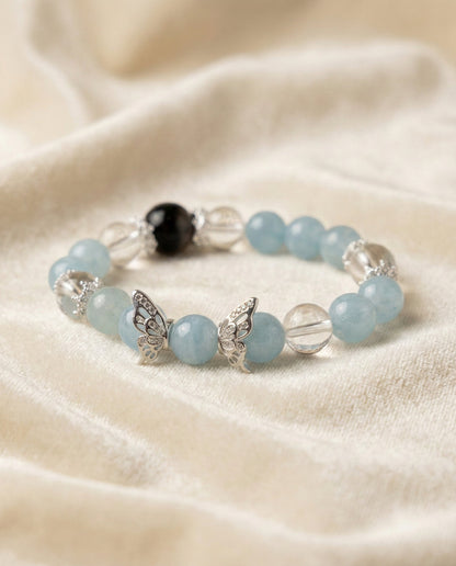 The Azure Whisper Bracelet, shown at a gentle angle on a light velvet surface.