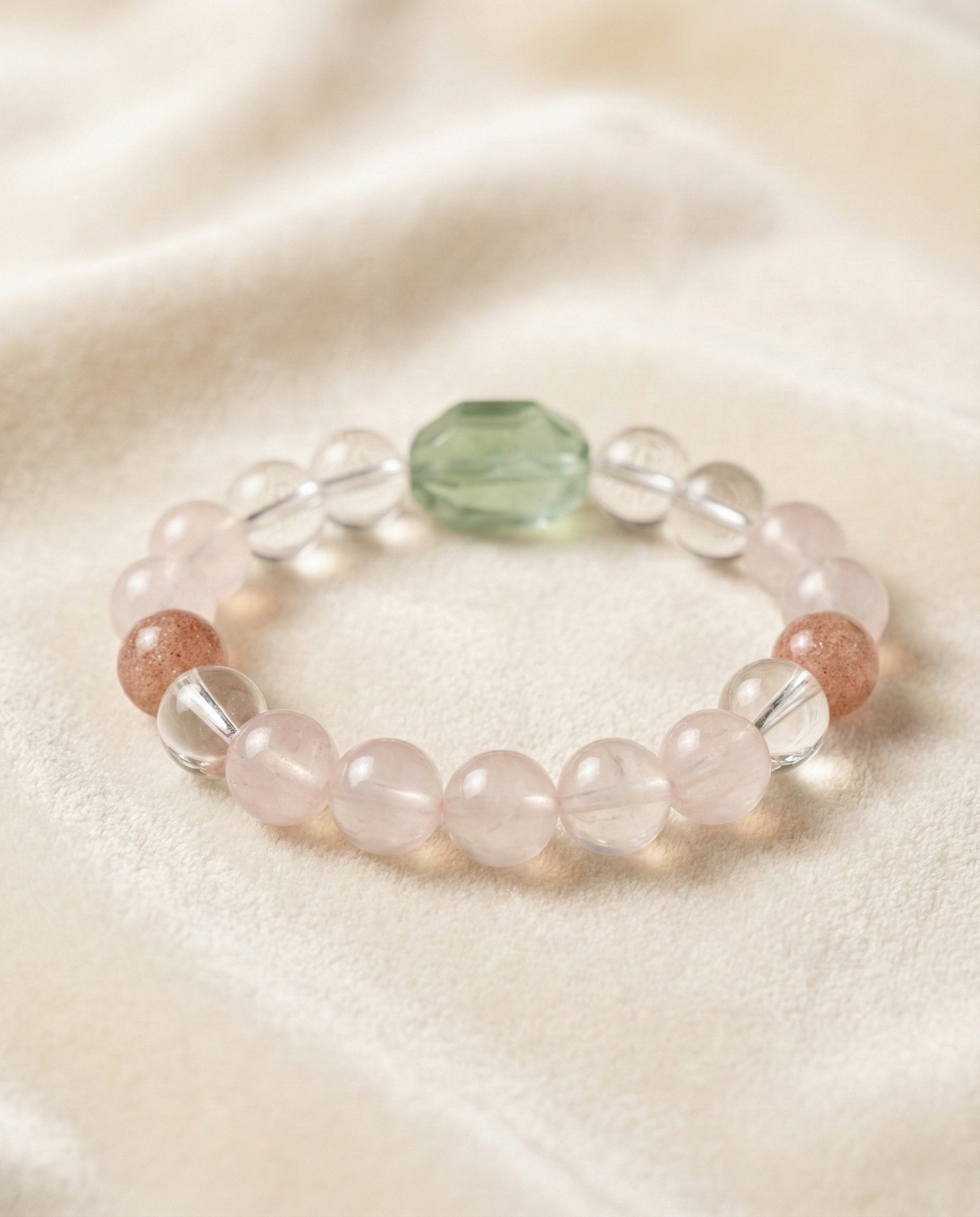 The Blooming Heart Bracelet, shown at a gentle angle on a light velvet surface.