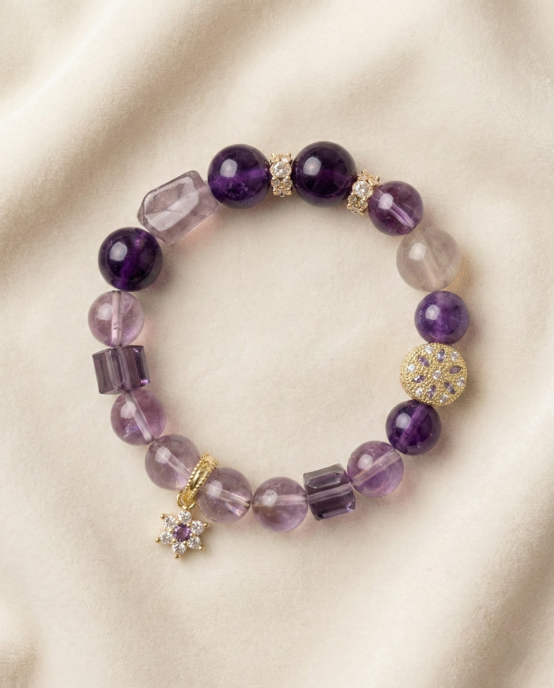 The Crown Sovereign Bracelet, photographed from above on a light velvet background.