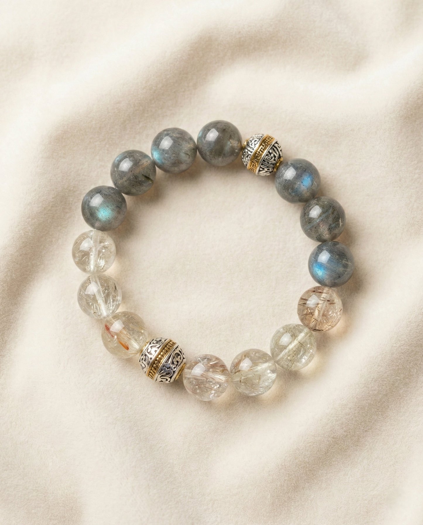 The Equilibrium Strand Bracelet, photographed from above on a light velvet background.