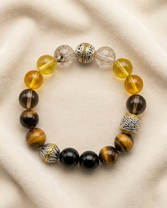 The Gilded Guardian Bracelet, photographed from above on a light velvet background.