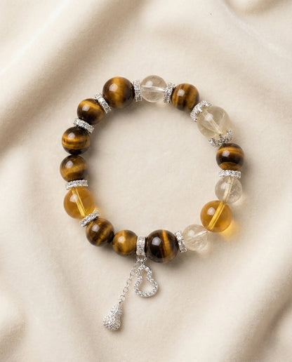 The Golden Ascendant Bracelet, photographed from above on a light velvet background.