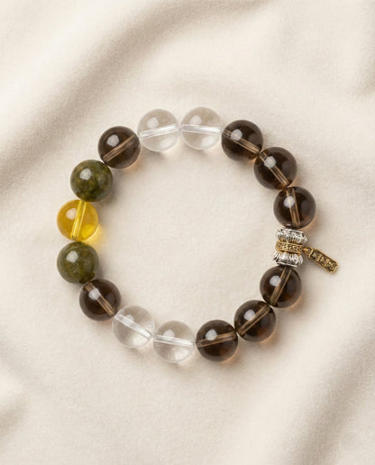 The Grounded Anchor Bracelet, photographed from above on a light velvet background.