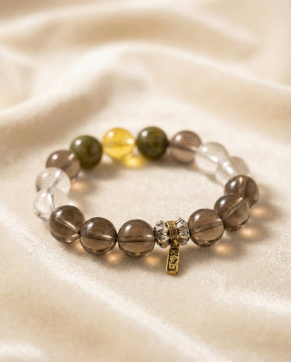 The Grounded Anchor Bracelet, shown at a gentle angle on a light velvet surface.