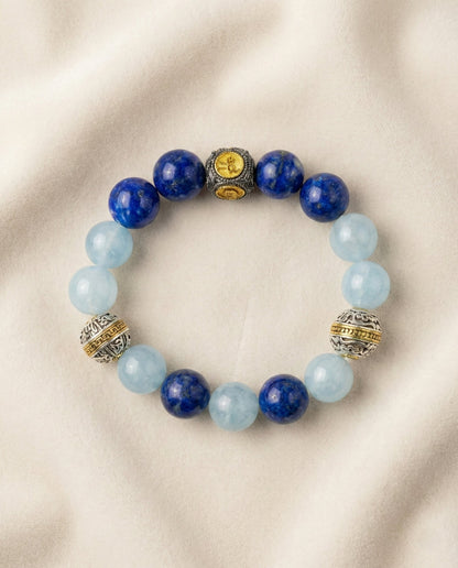 The Meridian Anchor Bracelet, photographed from above on a light velvet background.