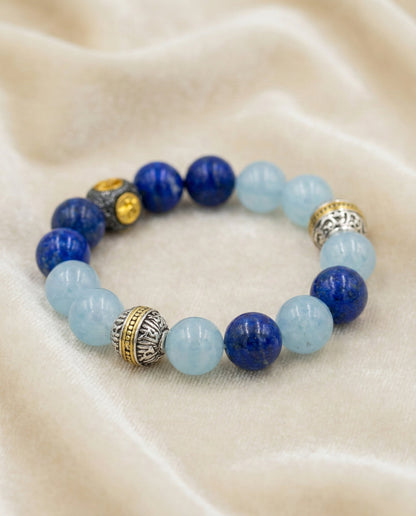 The Meridian Anchor Bracelet, shown at a gentle angle on a light velvet surface.