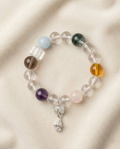 The Prism Harmony Bracelet, photographed from above on a light velvet background.