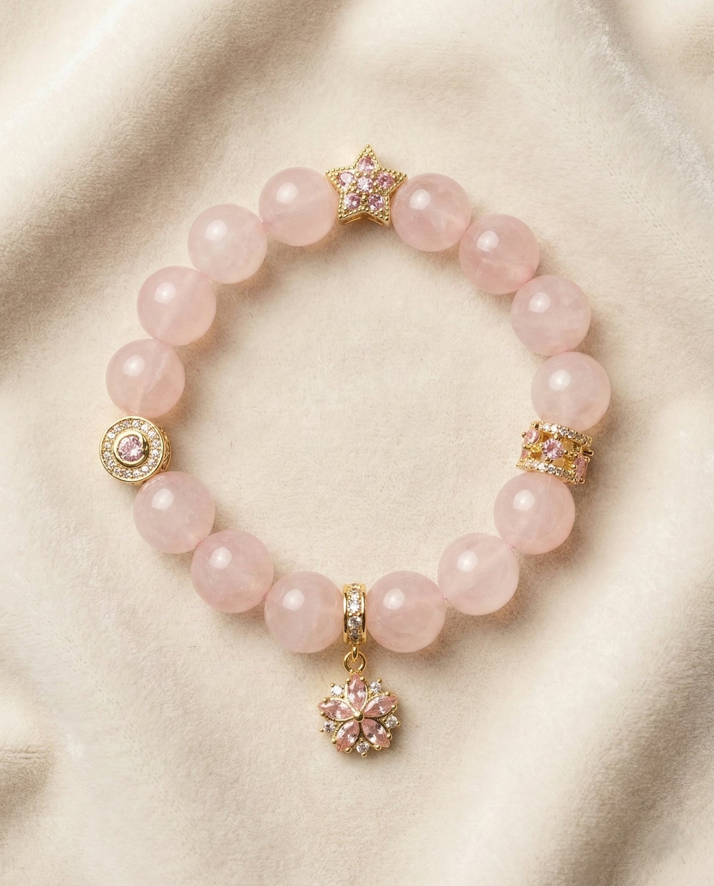 The Rose Flora Bracelet, photographed from above on a light velvet background.