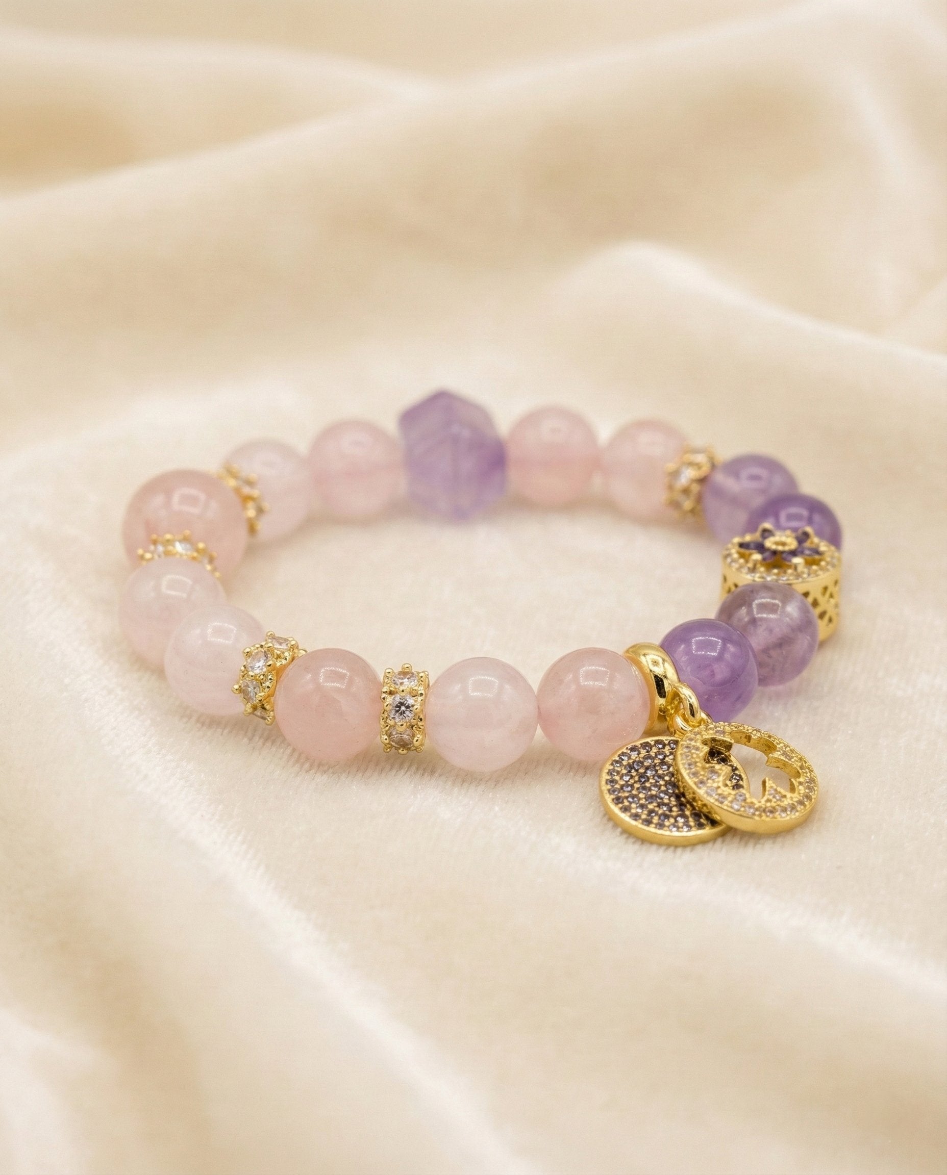 The Serendipity Bracelet, shown at a gentle angle on a light velvet surface.