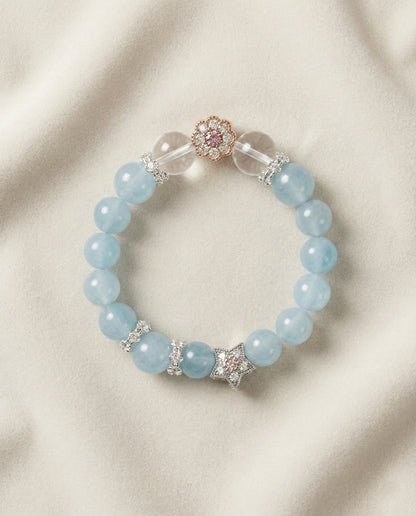 The Serene Whisper Bracelet, photographed from above on a light velvet background.