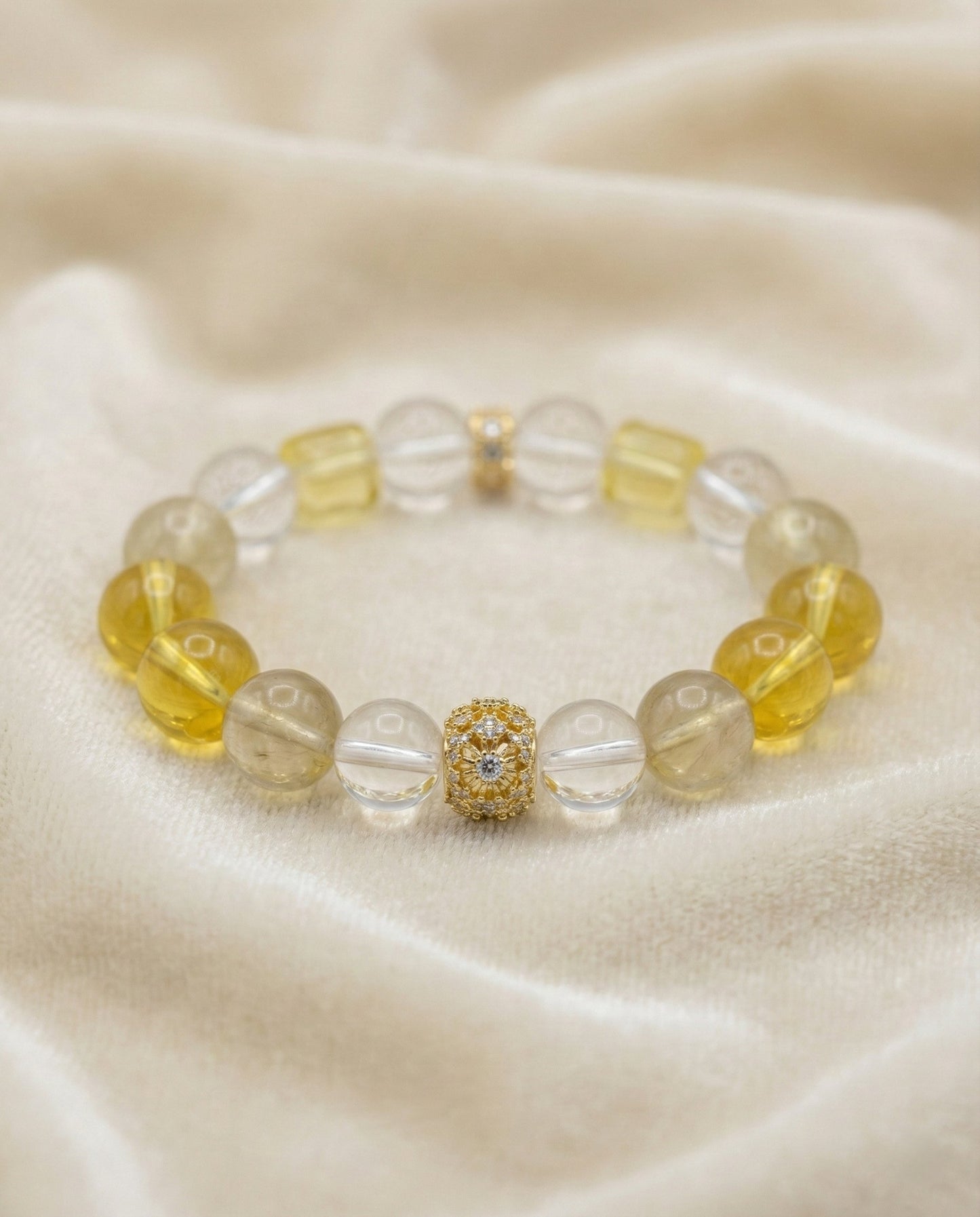 The Solar Ascendant Bracelet, shown at a gentle angle on a light velvet surface.