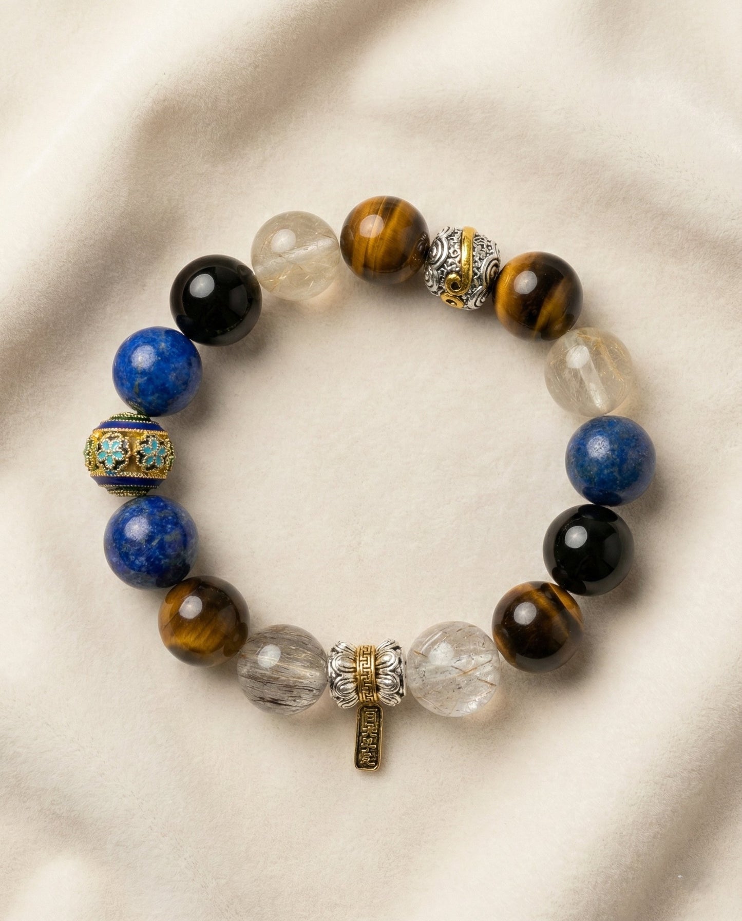 The Sovereign Barcelet, photographed from above on a light velvet background.