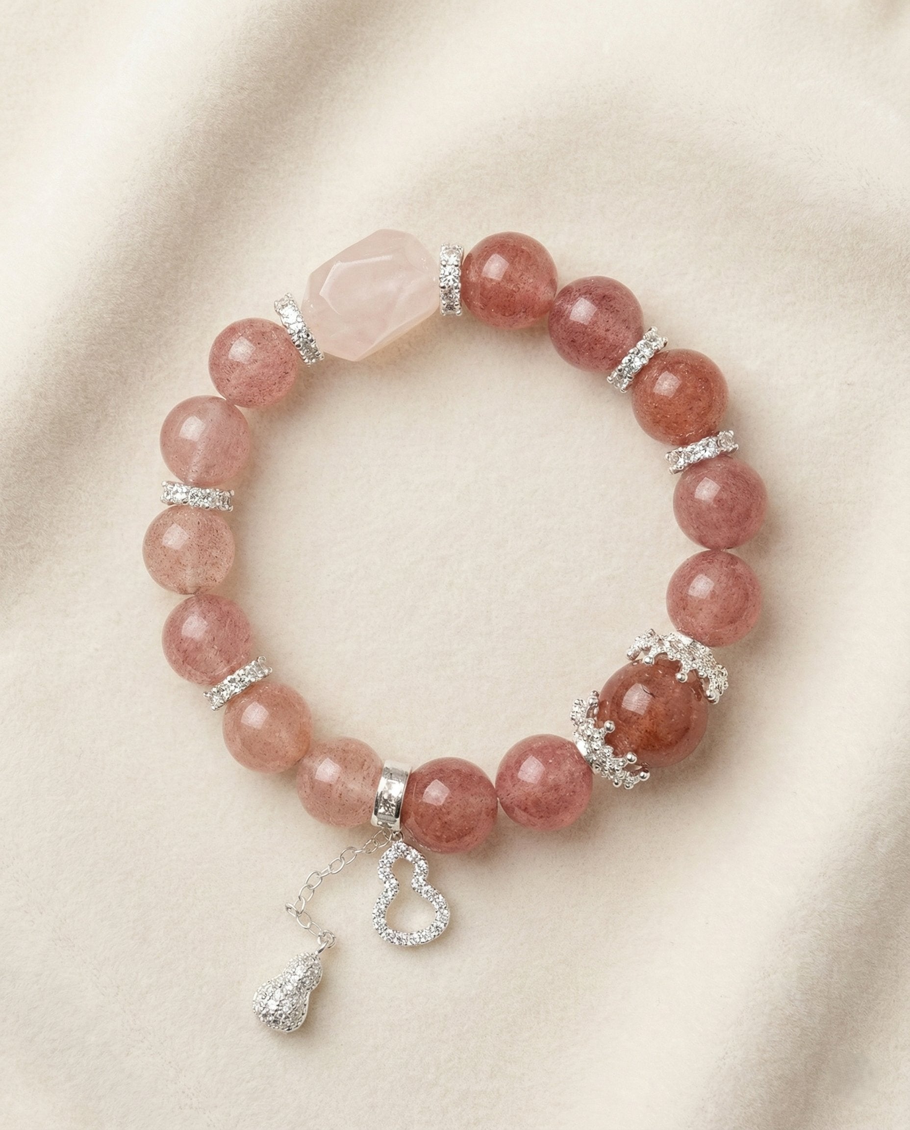 The Sweet Embrace Bracelet, photographed from above on a light velvet background.