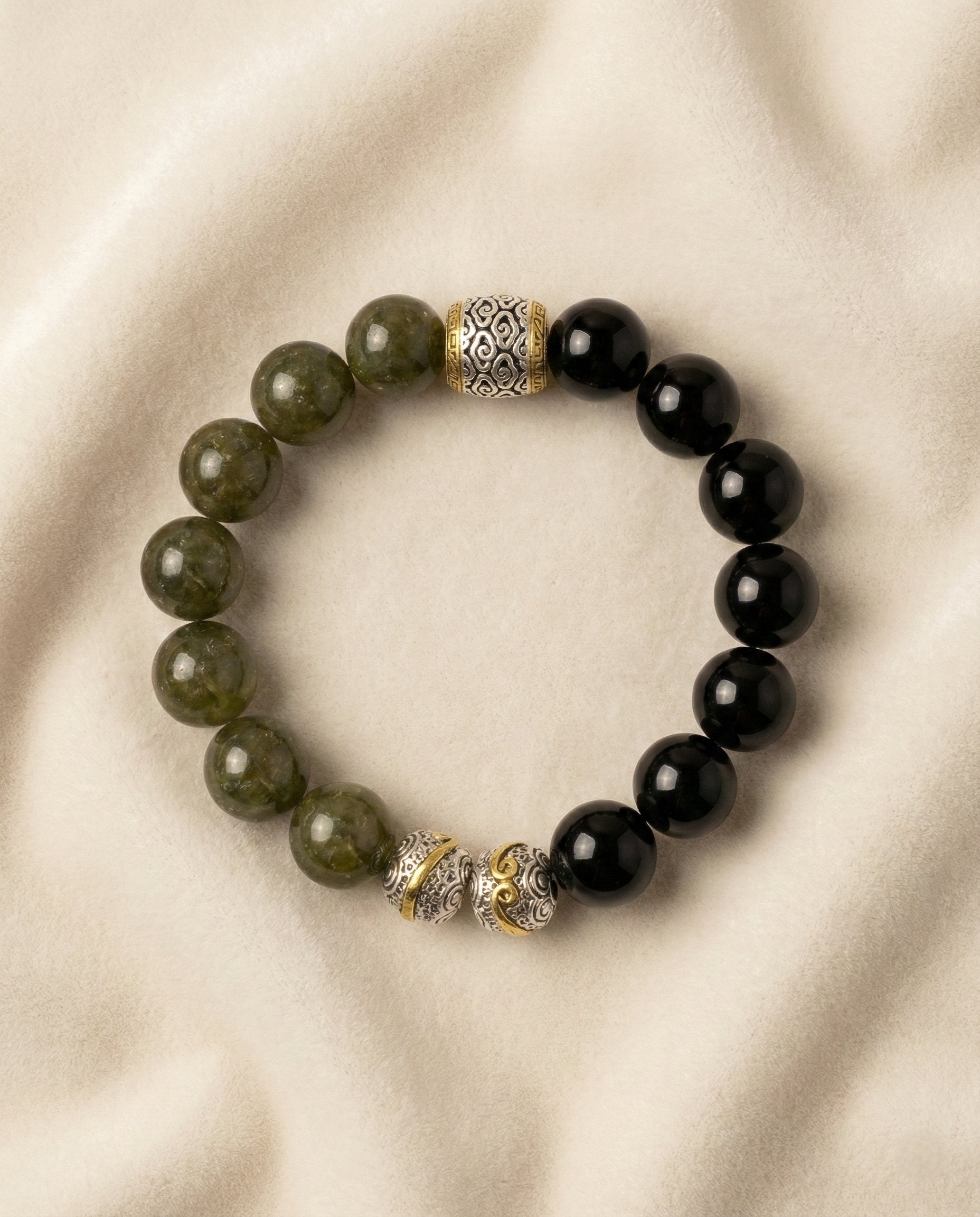 The Verdant Guardian Bracelet, photographed from above on a light velvet background.
