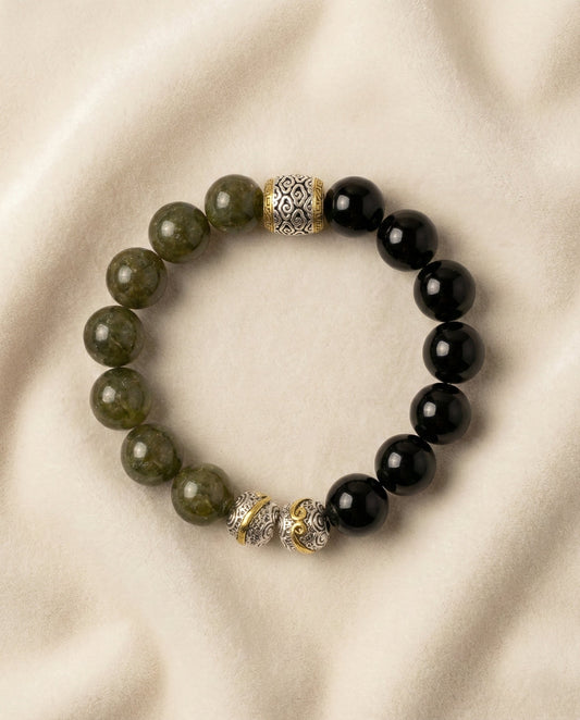 The Verdant Guardian Bracelet, photographed from above on a light velvet background.