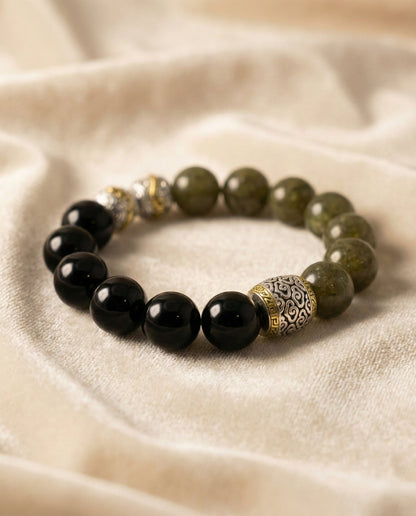 The Verdant Guardian Bracelet, shown at a gentle angle on a light velvet surface.