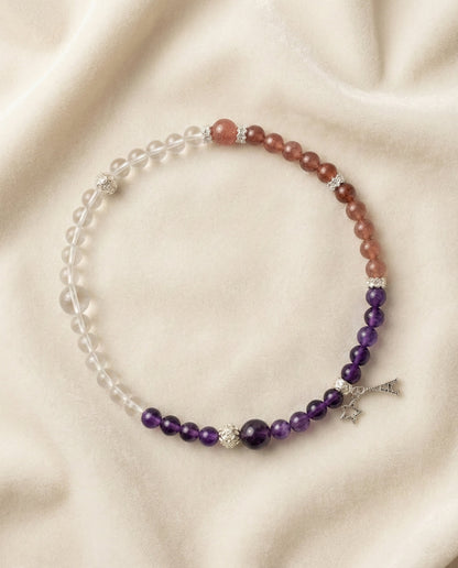 The Trinity Grace Bracelet, shown at a gentle angle on a light velvet surface.